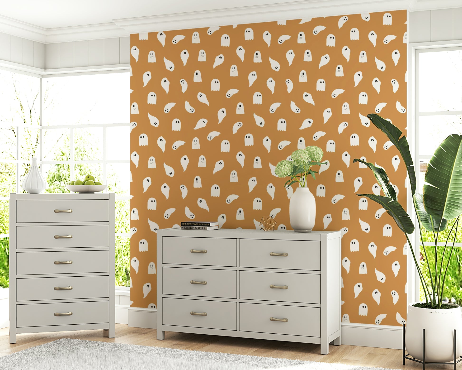 Soft, friendly ghost figures floating across a minimal spooky design.