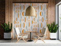 Atomic-era inspired wallpaper featuring symmetrical ovals in warm orange and soft blue tones.