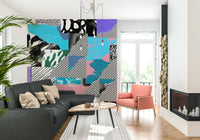 Colorful abstract shapes layered with stripes and dots create a fun, upbeat party wallpaper look.
