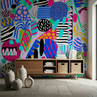 Colorful abstract shapes layered with stripes and dots create a fun, upbeat party wallpaper look.