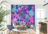 Eclectic geometric prints in neon tones arranged in a bold groovy wallpaper composition.