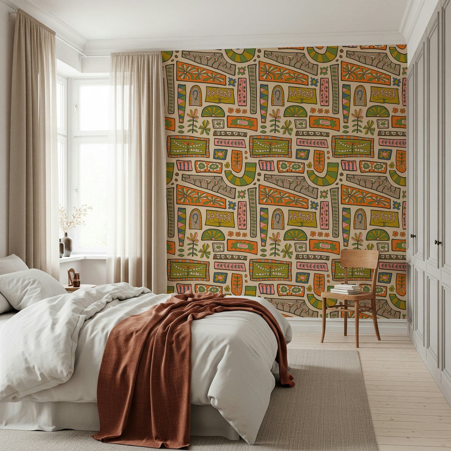 Warm earthy shades forming a retro patchwork of flowers and shapes in this bohemian wallpaper design.