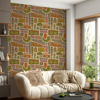 A vibrant mod-style wallpaper with patchwork panels of orange, olive, tan, and pink floral patterns.