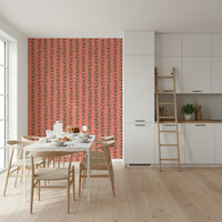 A charming vintage-style wallpaper with colorful leaves arranged along slim vertical vines on pink.