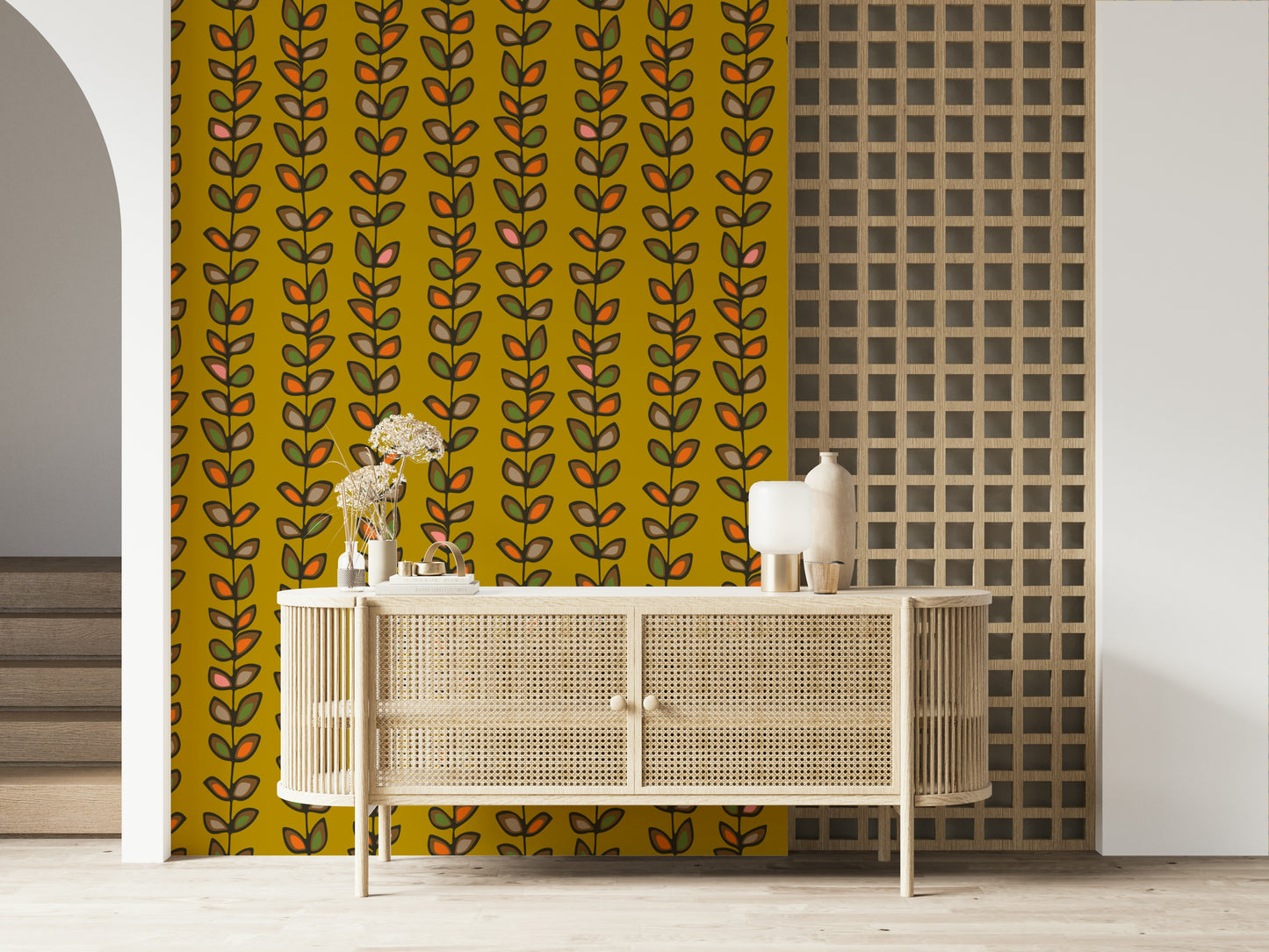 Mustard yellow wallpaper decorated with repeating vine stripes and outlined retro-style leaf motifs.