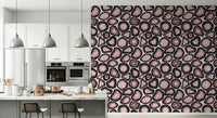 Organic agate shapes in soft pink tones forming a gemstone-inspired wallpaper design.