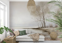 A tranquil snowy-shore wallpaper featuring slender trees against a muted winter sky.