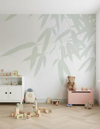 Subtle bamboo foliage spread across a pale backdrop forming a soothing nature-inspired wallpaper.