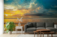 Soft waves rolling onto a glowing shoreline at sunset captured in a tranquil Borneo Beach wallpaper.