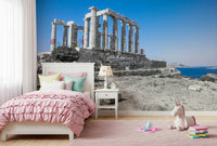 This wallpaper offers a panoramic view of the Poseidon Temple framed by clear blue skies and distant islands.
