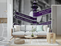 A travel-inspired wallpaper showing London street signs in bold purple, adding a metropolitan flair to the space.