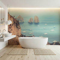 The wallpaper showcases majestic Faraglioni rock formations surrounded by luxurious white yachts on tranquil waters.