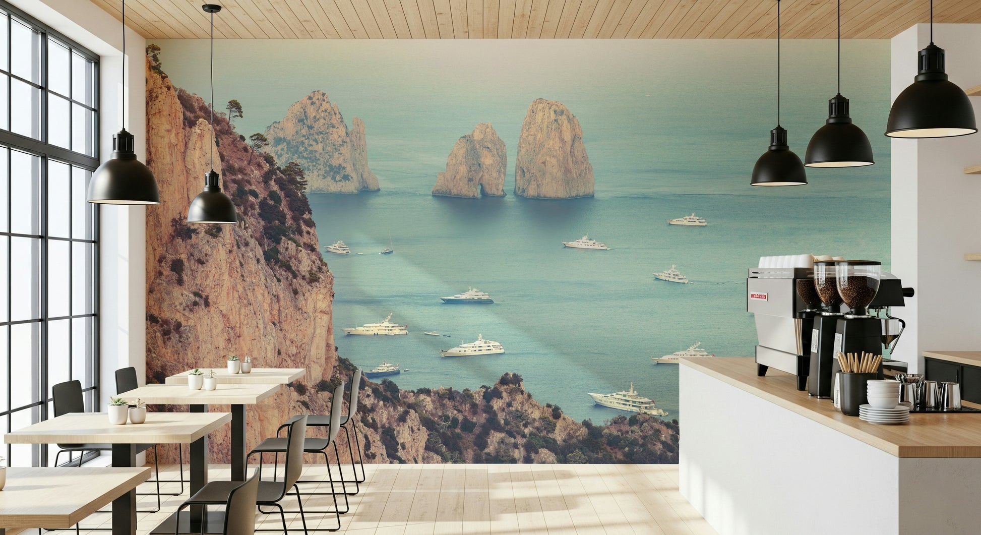A serene coastal wallpaper featuring the iconic Faraglioni cliffs framed by calm blue sea and scattered boats.
