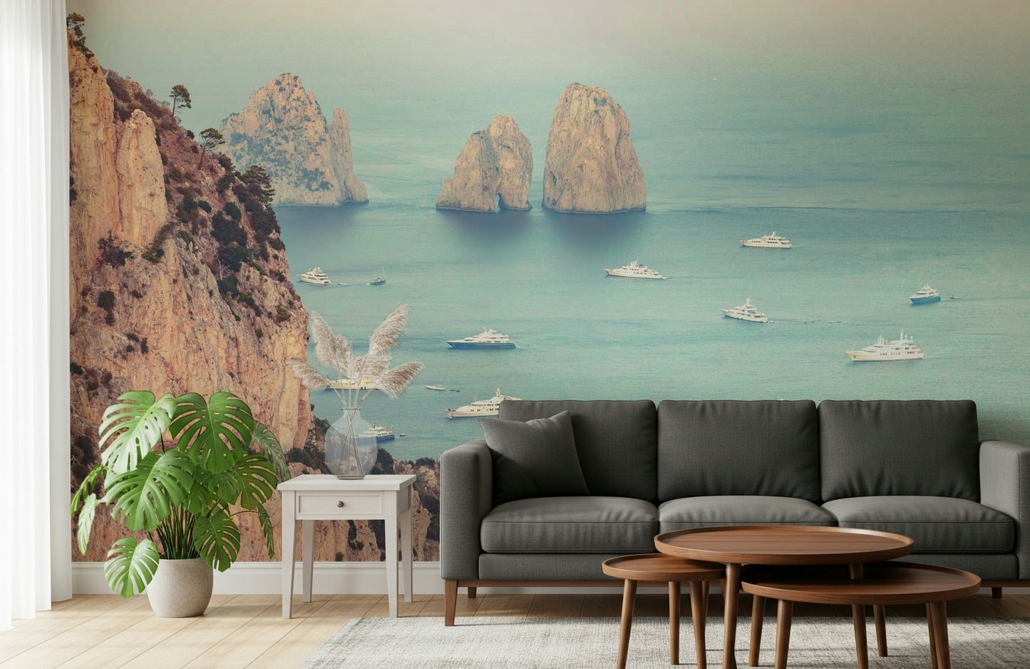 This wallpaper captures the iconic Faraglioni cliffs with a dreamy ocean backdrop and luxury boats scattered below.