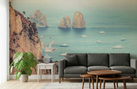 This wallpaper captures the iconic Faraglioni cliffs with a dreamy ocean backdrop and luxury boats scattered below.