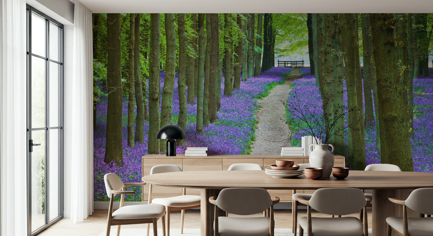 Spring forest wallpaper filled with rich purple-blue flowers and fresh green foliage.