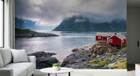 Nordic escape mural featuring rugged fjord cliffs, shimmering water, and a classic red stilt house.