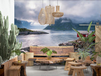 Norwegian fjord escape wall mural featuring red waterfront cabins overlooking calm blue water and misty mountains.