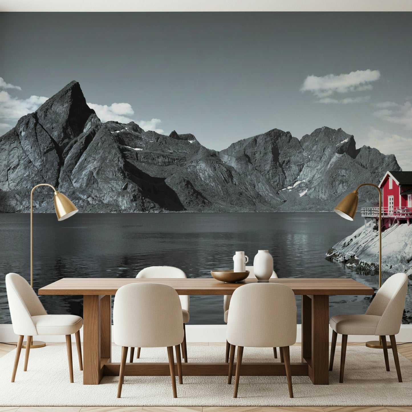 Coastal mountain mural with massive fjord cliffs and a vibrant red cabin at the water's edge.