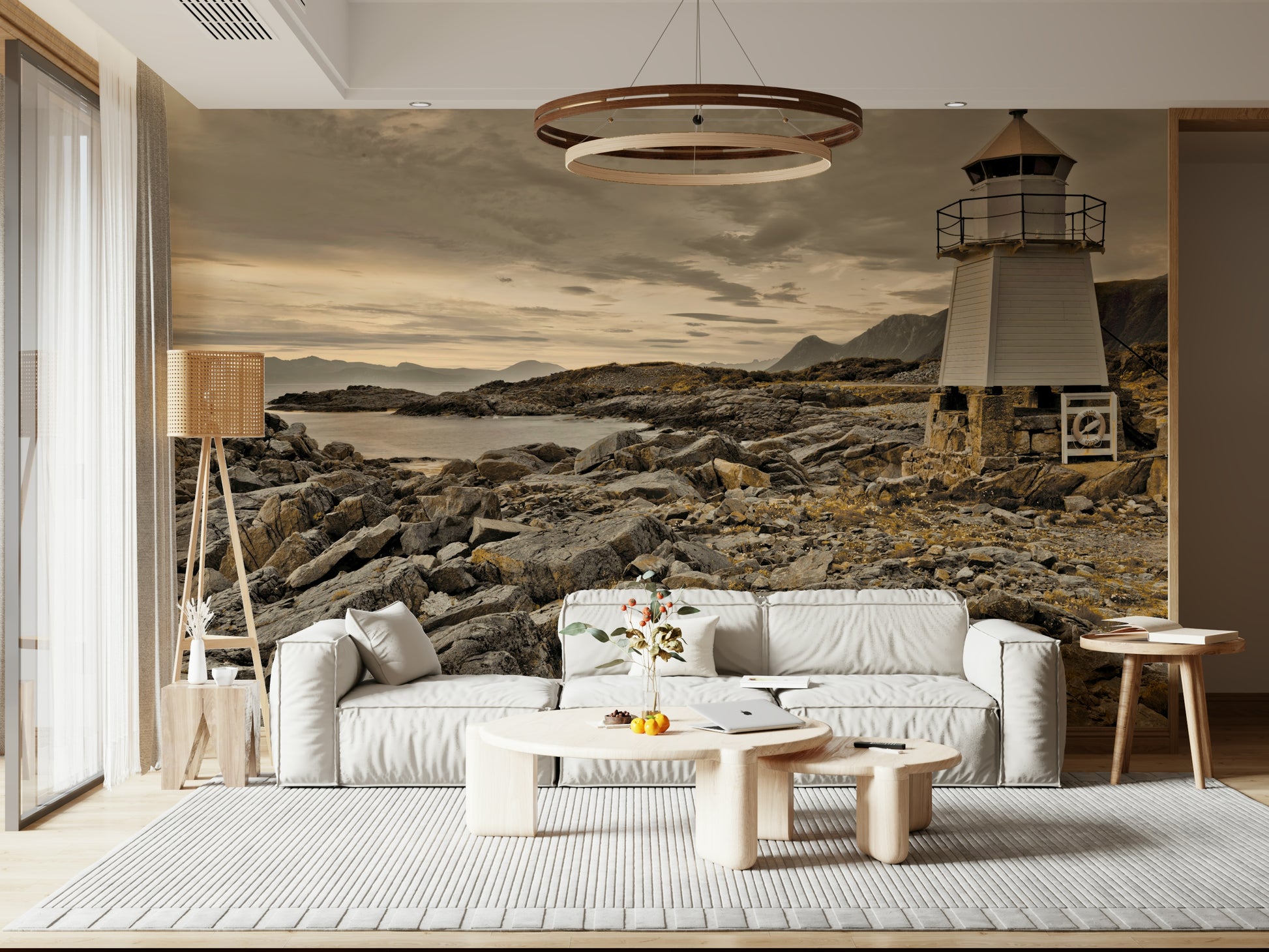 Atmospheric mural with a lighthouse rising above jagged coastal rocks and muted ocean light.