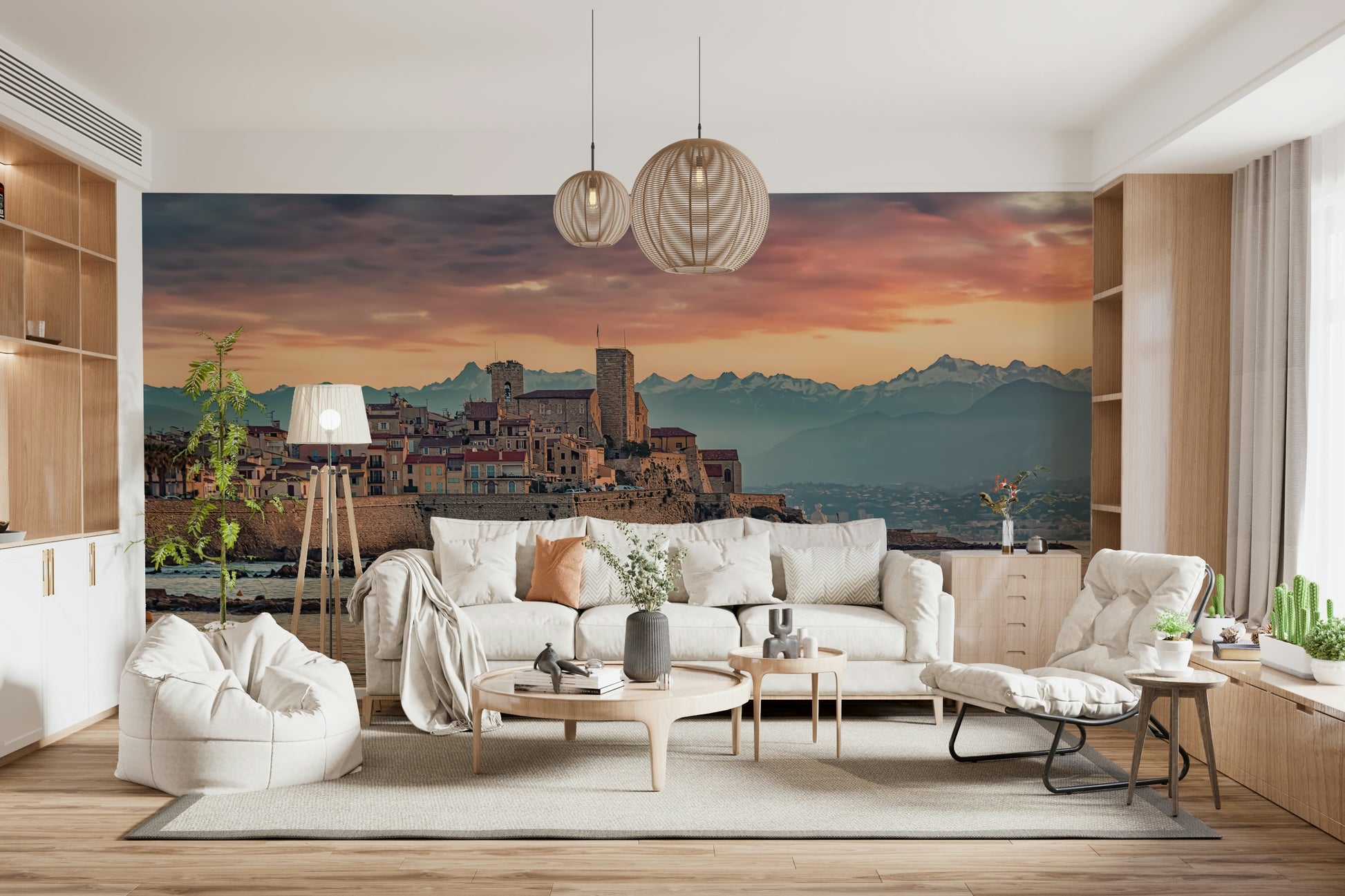 Twilight mural capturing the warm glow over Antibes’ coastal stone structures and mountains beyond.