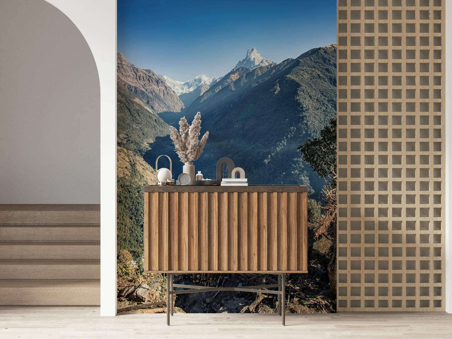 Nature wall mural featuring rugged mountains, a shaded valley, and a simple wooden hut.