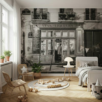 Authentic bistro windows and balconies above the shop mural.