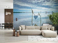 Twig structure holding Bound by Love wall mural serene ocean.