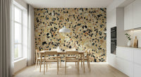 Earthy mosaic wallpaper with contrasting dark fragments.