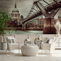 Striking wall mural image of modern bridge structure over river Thames.