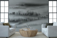 Forest trees shrouded in dense fog, captivating natural wallpaper design.