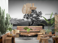 Solitary Woodland mural displaying stark contrast between water and rugged peaks.