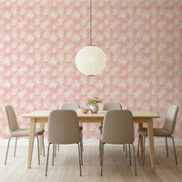 Tropical Blush wall covering pink background white leaves design.