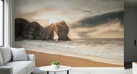 Iconic Durdle Door wall art, famous coastal archway, bright sun rays.
