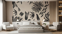 Organic foliage wall mural framing a Bedroom with dark fern shapes