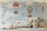 Sky adventure wall mural in a bedroom with balloons, planes, and animals