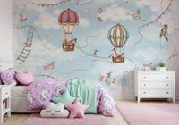 Sky-themed Adventure wall mural with clouds, bunting, and floating elements