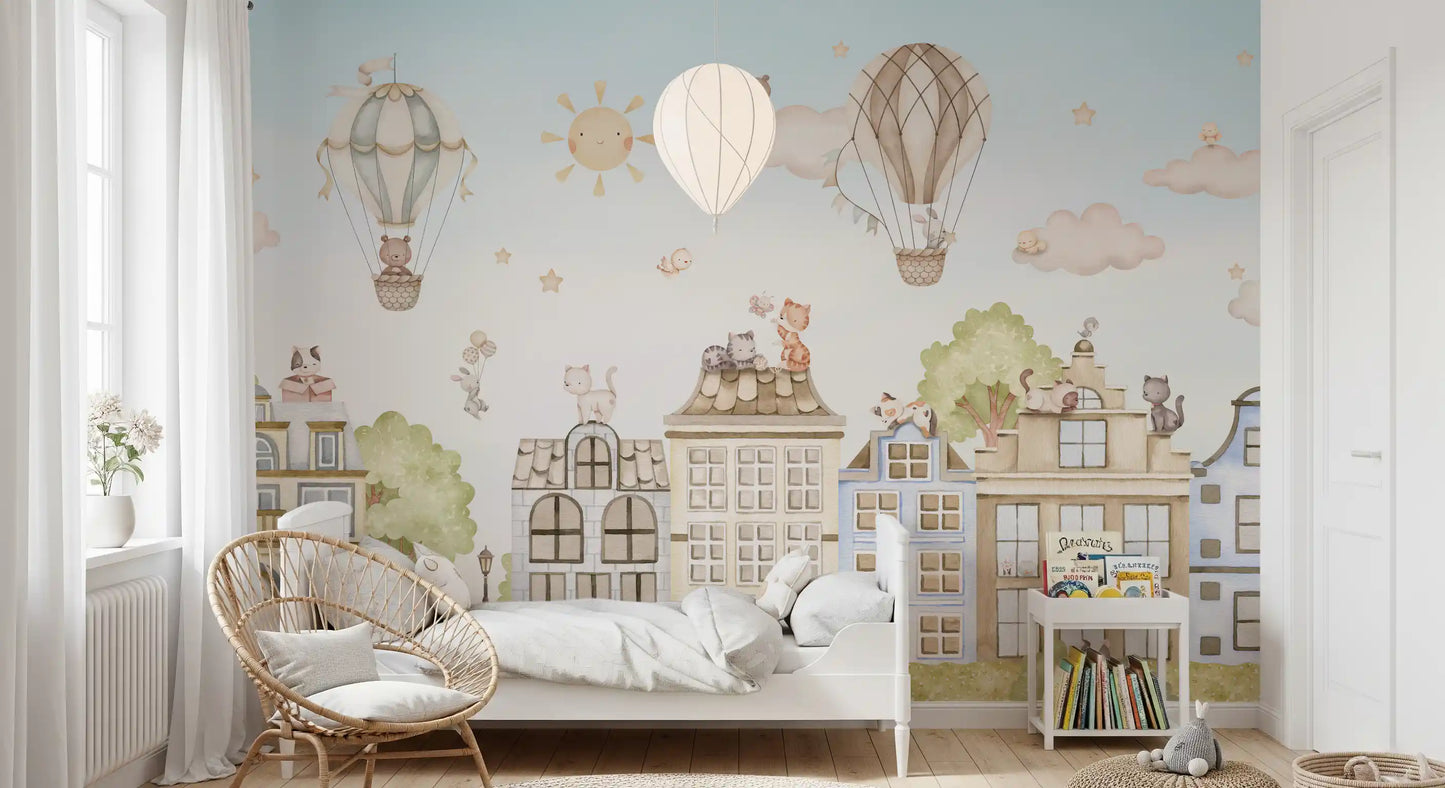 City Cats wall mural with balloons, clouds, and structured buildings