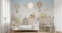 City Cats wall mural with balloons, clouds, and structured buildings