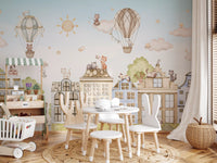 Cityscape wall mural with illustrated buildings and playful cat characters