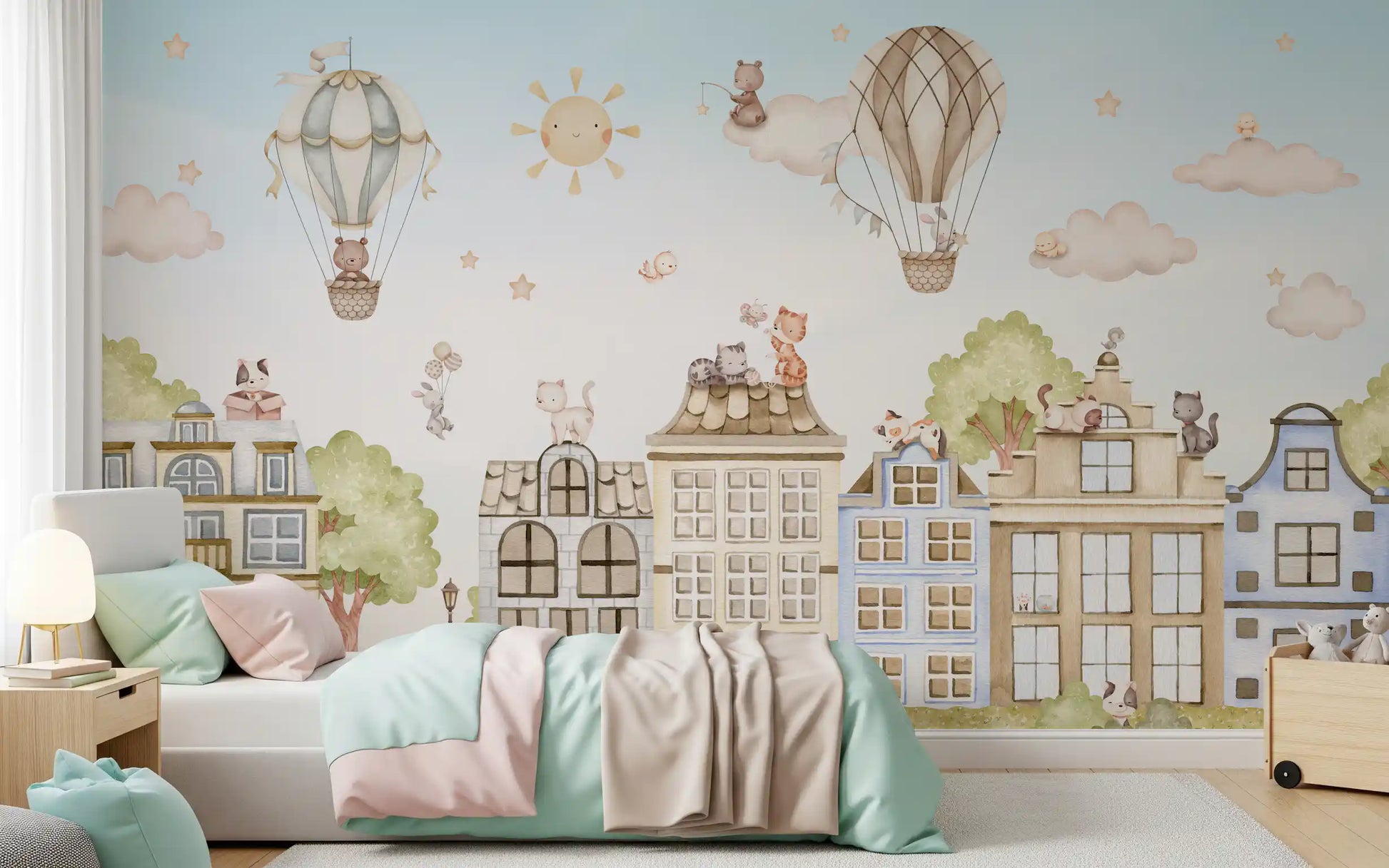 Kids city wall mural with soft pastel houses and rooftop cats