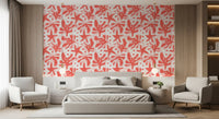 Coral abstract wallpaper in a bedroom with layered blush and beige forms