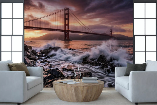 Living room wall mural with Golden Gate waves and dramatic sunset skyline