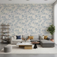 Living room styled with Serene Blossom Branches wallpaper in blue tones