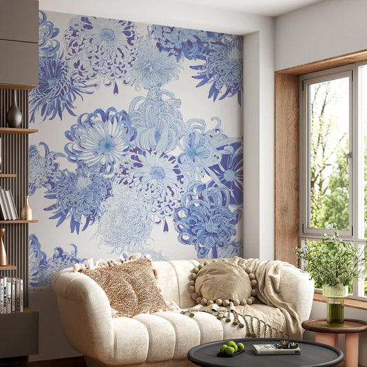 Indigo chrysanthemums cover the living room behind a low sofa in this wall mural.