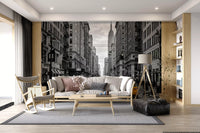 Urban street wall mural with taxis, buildings, and skyline depth