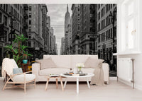 Black and white wall mural with yellow cabs and city road detail