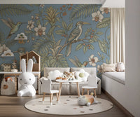 Play area wall shows Exotic Serenity Botanical Aviary mural in soft blue