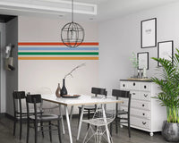 Dining room dressed in Horizontal Stripes wall mural showing red, blue, green, yellow

