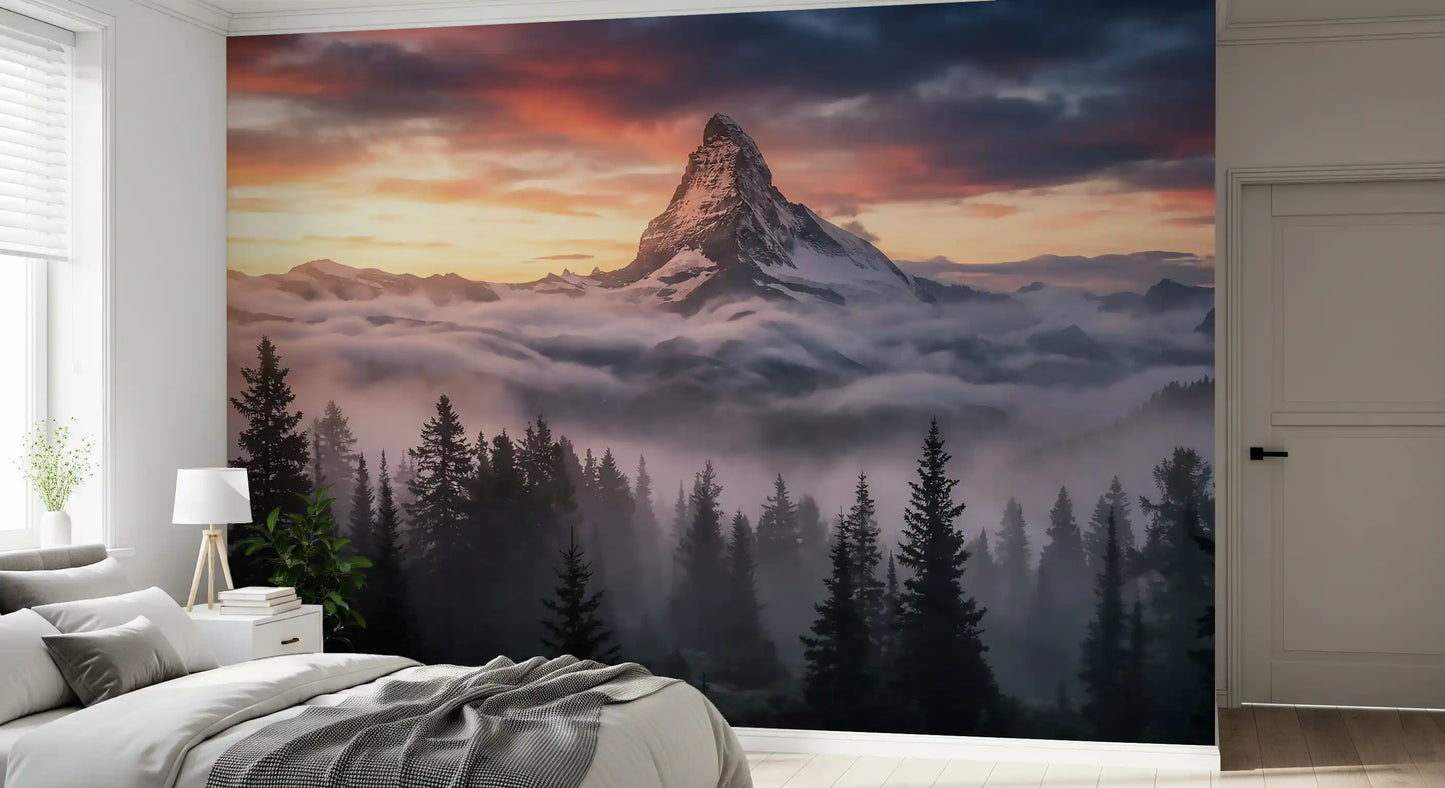 Snowy summit wall mural with forest silhouettes and layered mist below